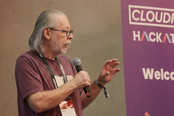 Brent Toderash at CloudFest, holding a microphone while speaking.